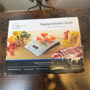 Mainstays Glass Digital Kitchen Scale with a 5000g/11 lb capacity.